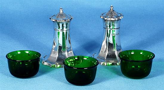 An Art Nouveau George V silver six piece cruet set, pepper height 82mm, weight 10.1oz/317grms.